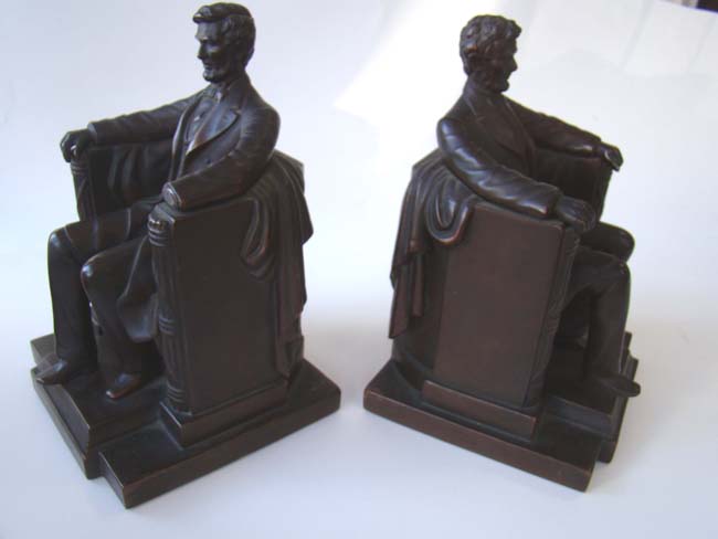 A pair of "Lincoln in the chair" antique bookends by Jennings Brothers circa 1925